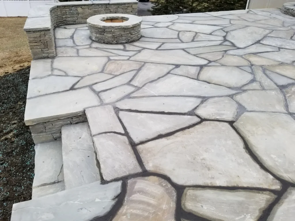 Flagstone patio and natural stone fire pit