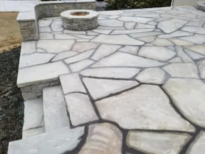 Flagstone patio and natural stone fire pit