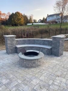 Manufactured stone fire pit seating area