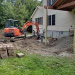 Excavator building a patio