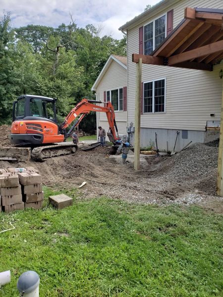 Excavator building a patio