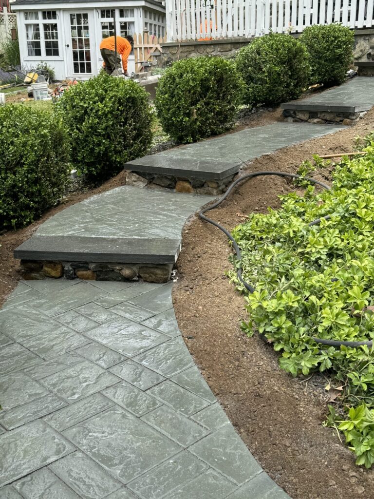 Front walkway in Cambridge bluestone blend pavers with natural bluestone stair treads.