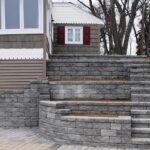 Manufactured stone tiered walls and steps