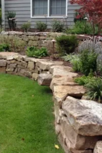 Natural stone rustic tiered retaining wall