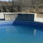 Natural stone pool water feature