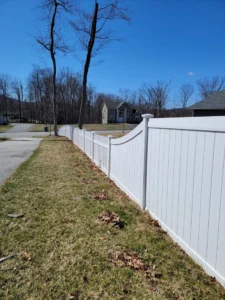 White vinyl fence transitioning from privacy to picket fencing