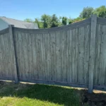 Scalloped wood privacy fence