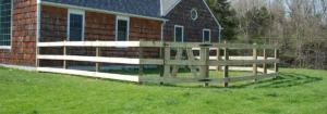 Wood split-rail fence with wire mesh