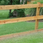 Wood split-rail fence with mesh