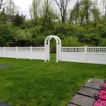 White vinyl fence with arbor arch