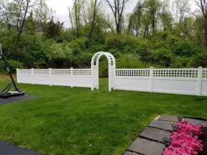 White vinyl fence with arbor arch