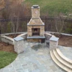Stone fireplace, patio, and pillars