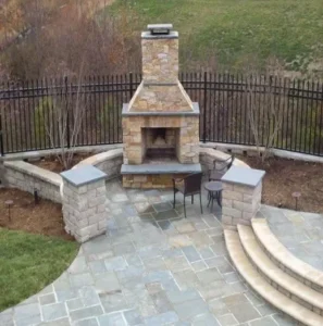 Stone fireplace, patio, and pillars