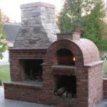 Brick and stone fireplace and pizza oven