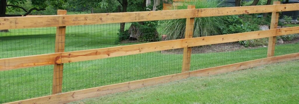 Split-rail wood fence with mesh